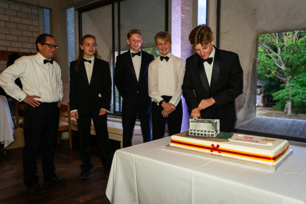 Cutting the cake at Governing Body and Honorary Fellows' Dinner